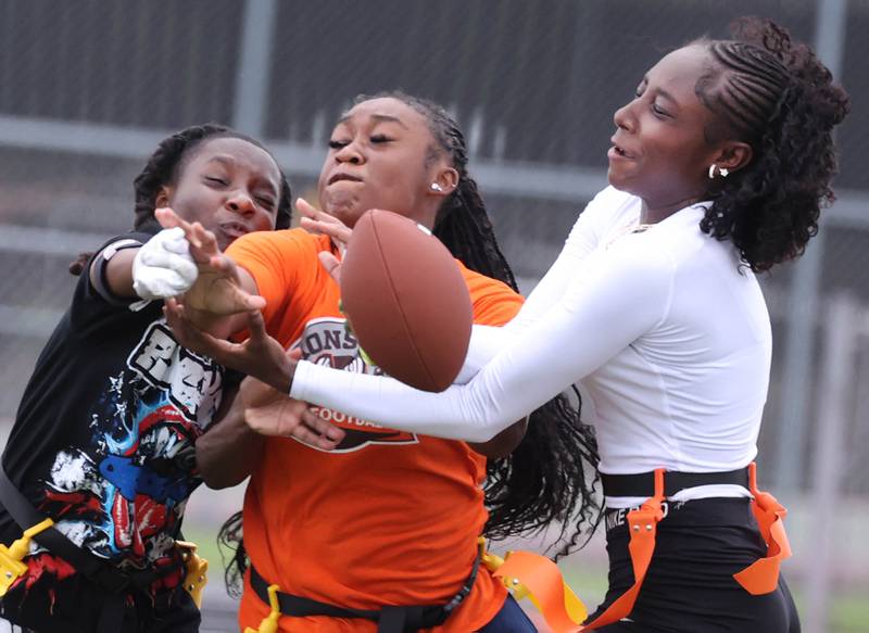 Players converge on a pass Wednesday, Aug. 20, 2025, during the first practice of the DeKalb High School flag football team. The squad is preparing for their inaugural season.