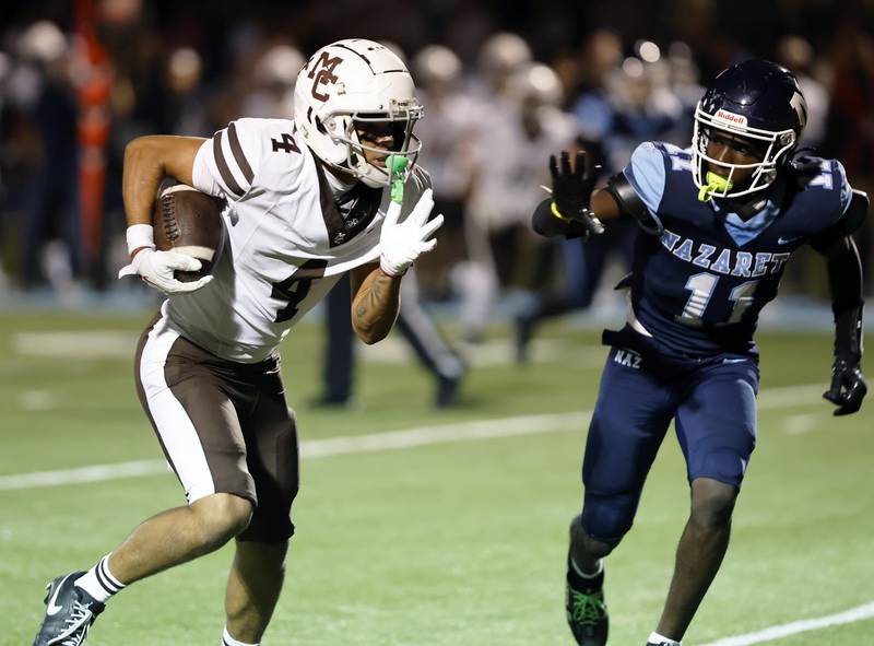 Mt. Carmel's Quentin Burrell (4) runs during the varsity football game between Mt. Carmel high school and Nazareth Academy on Friday, Sept. 12, 2025 in La Grange Park, IL.