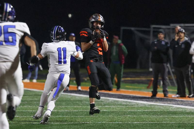 Minooka’s Ty Couch pulls in the deep pass against Lincoln-Way East on Friday, Nov. 8, 2024 in Minooka.