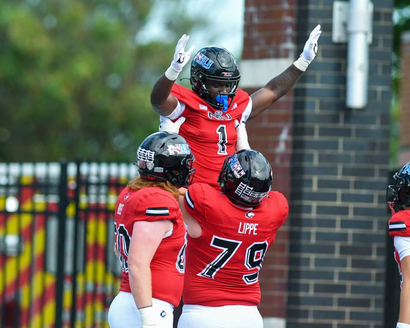 Northern Illinois Huskies running back Antario Brown (1) celebrates with teammate J.J. Lippe (79) after a touchdown during the game on Saturday Sept. 21, 2024, while taking on Buffalo at Huskie Stadium in DeKalb.