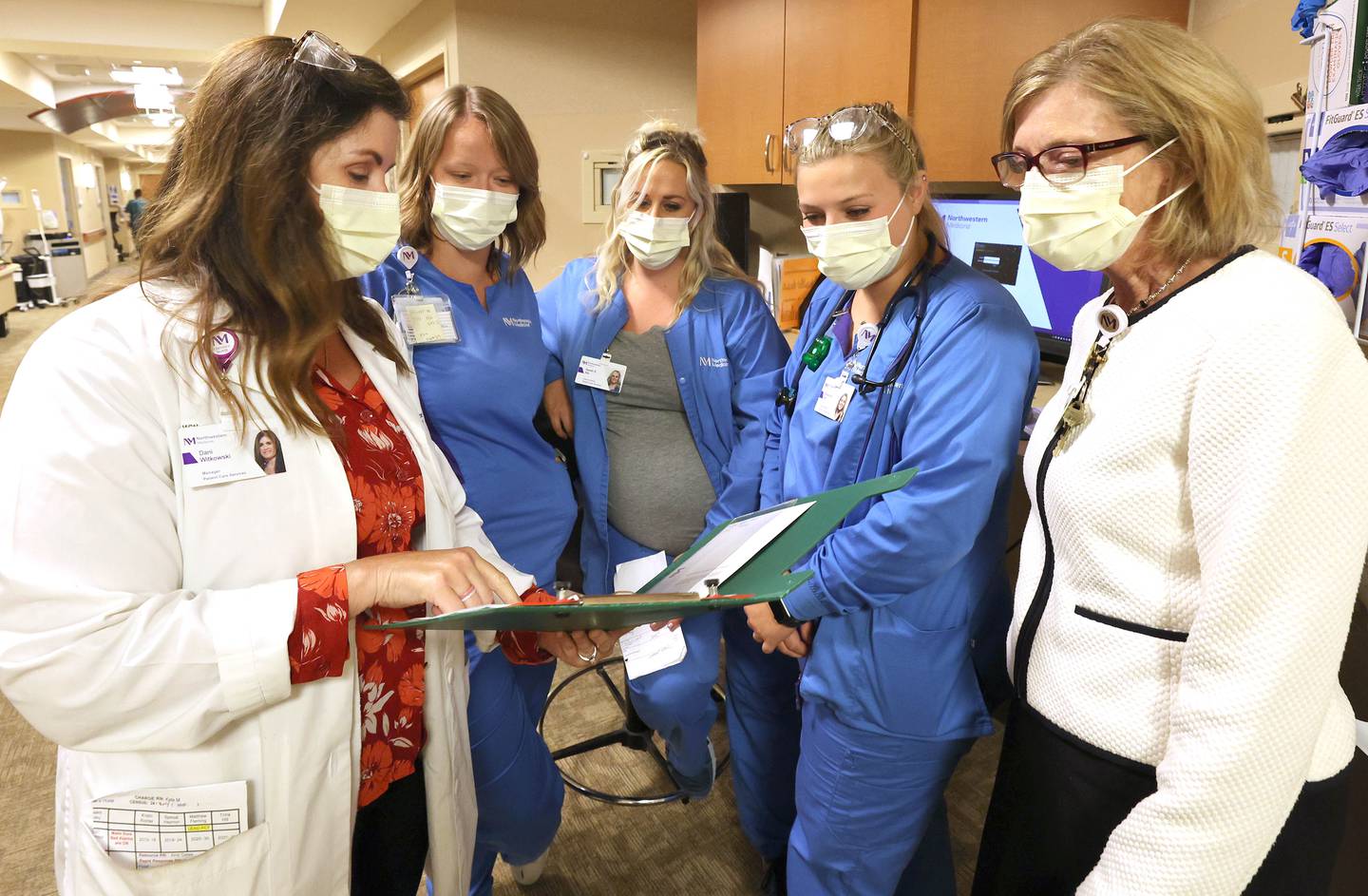 Dani Witkowski, (left to right) registered nurse and nursing manager, Kellie Armstrong, registered nurse, Sarah Lyons, registered nurse, Breann Aubry, registered nurse, and Corinne Haviley, chief nursing executive, talk Tuesday, July 26, 2022, at Northwestern Medicine Kishwaukee Hospital in DeKalb.