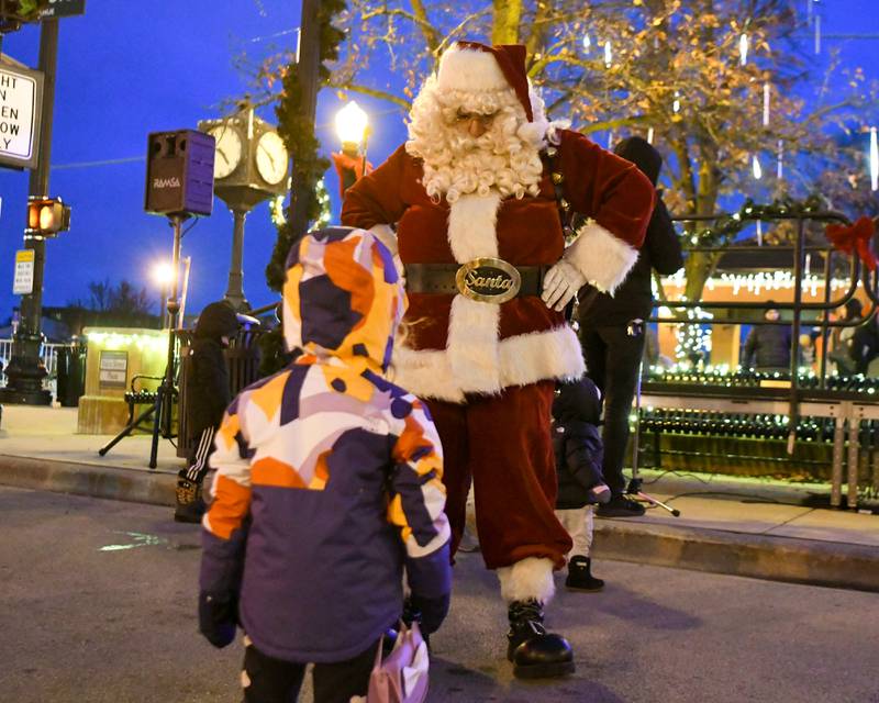 Sasha Graft, 3, of Downers Grove is star struck after meeting Santa Clause on Friday Nov. 29, 2024, during the Christmas Tree lighting ceremony held in downtown Downers Grove.