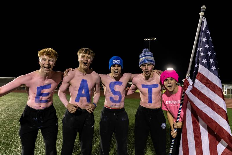 Lincoln-Way East’s flag-bearers brave the cold to share school spirit prior to a varsity football game against Sandburg at Lincoln-Way East on Oct. 23, 2025.