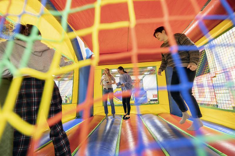 No one can resist a bouncy house, especially college students, as seen at SaukFest on Wednesday, Feb. 1, 2023.