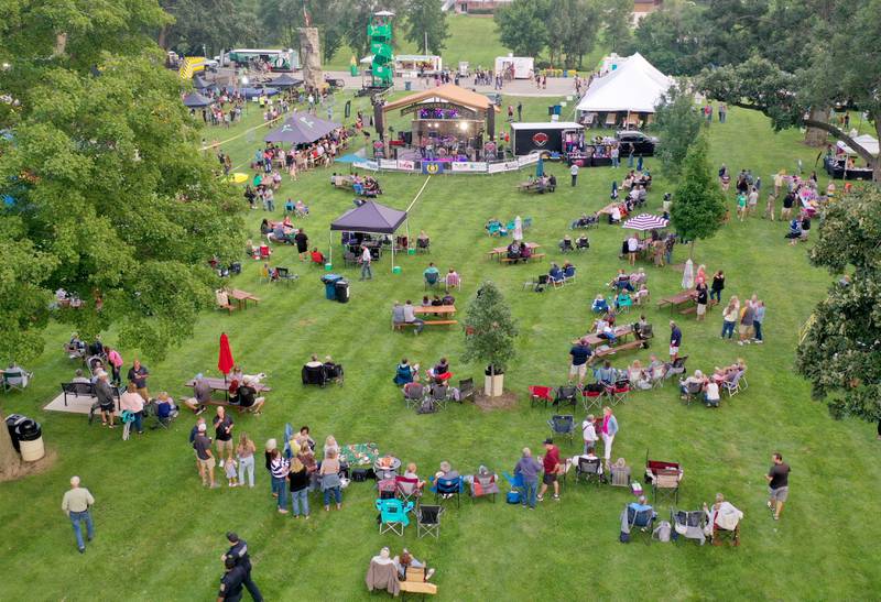 People watch bands play during the The Taste of the Illinois Valley on Friday, Aug. 1, 2025 at Centennial Park in Peru. The event featured food vendors, live music, a beer tent and a kids zone, Dreamwave wrestling and Pandora's Box, a Aerosmith tribute band.