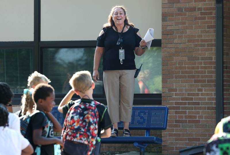 Lincoln Elementary School Principal Jennifer Tallitsch welcomes students for the first day of classes Wednesday, Aug. 14, 2024, at the school in DeKalb.