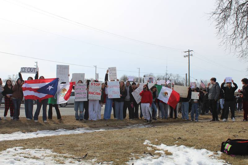 Crystal Lake Central Students hold up signs protesting against Immigration and Customs Enforcement along Route 14 on Feb. 9, 2026.