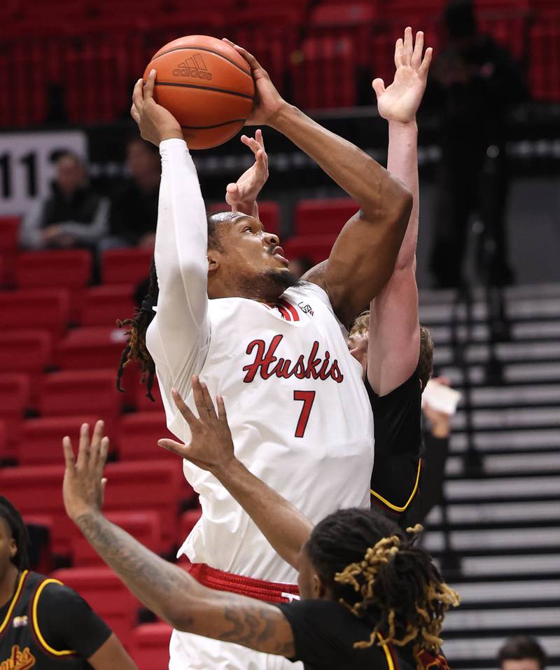 Northern Illinois forward Hassan Washington looks to score against two Louisiana-Monroe defenders Monday, Nov. 3, 2025, during their game at the Convocation Center at NIU in DeKalb.