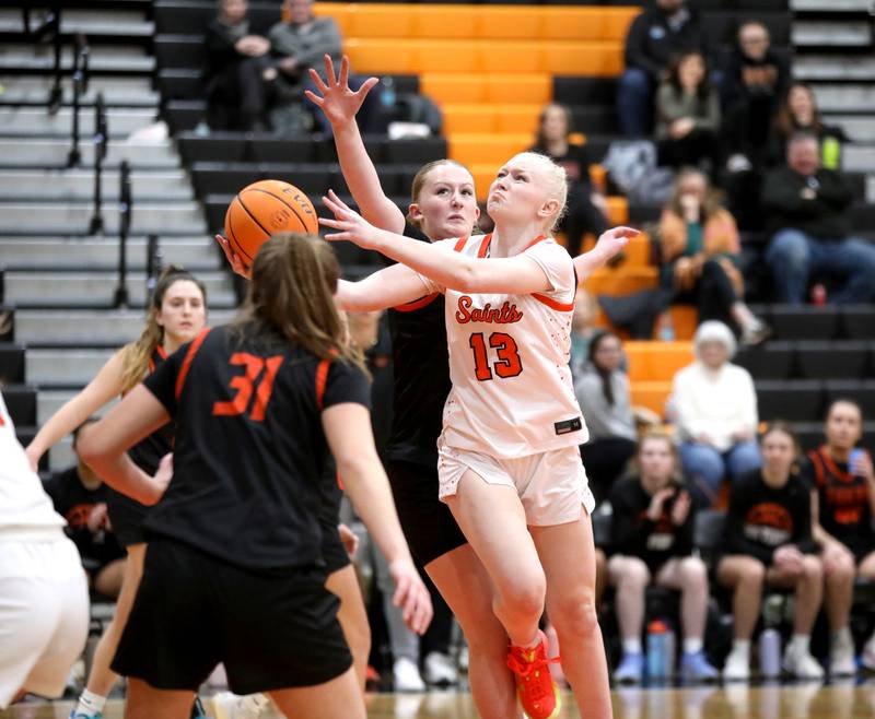St. Charles East's Addie Schilb attempts a shot during a game against Wheaton Warrenville South on Tuesday, Feb. 11, 2025 in St. Charles.