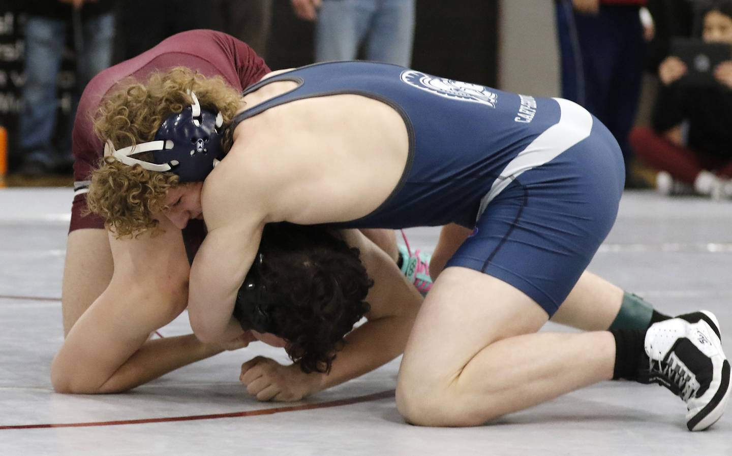 Cary-Grove’s Noah Pechotta controls Prairie Ridge’s Shaun Brewis in a 165-pound match of the IHSA 2A Antioch Wrestling Regional on Saturday, Feb. 8, 2025, at Antioch High School.