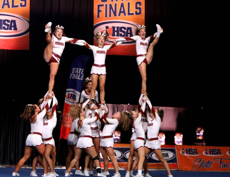 Members of the Morris cheerleading team compete in the medium team division of the IHSA State Finals on Saturday, Feb. 8, 2025 at Grossinger Motors Arena in Bloomington.