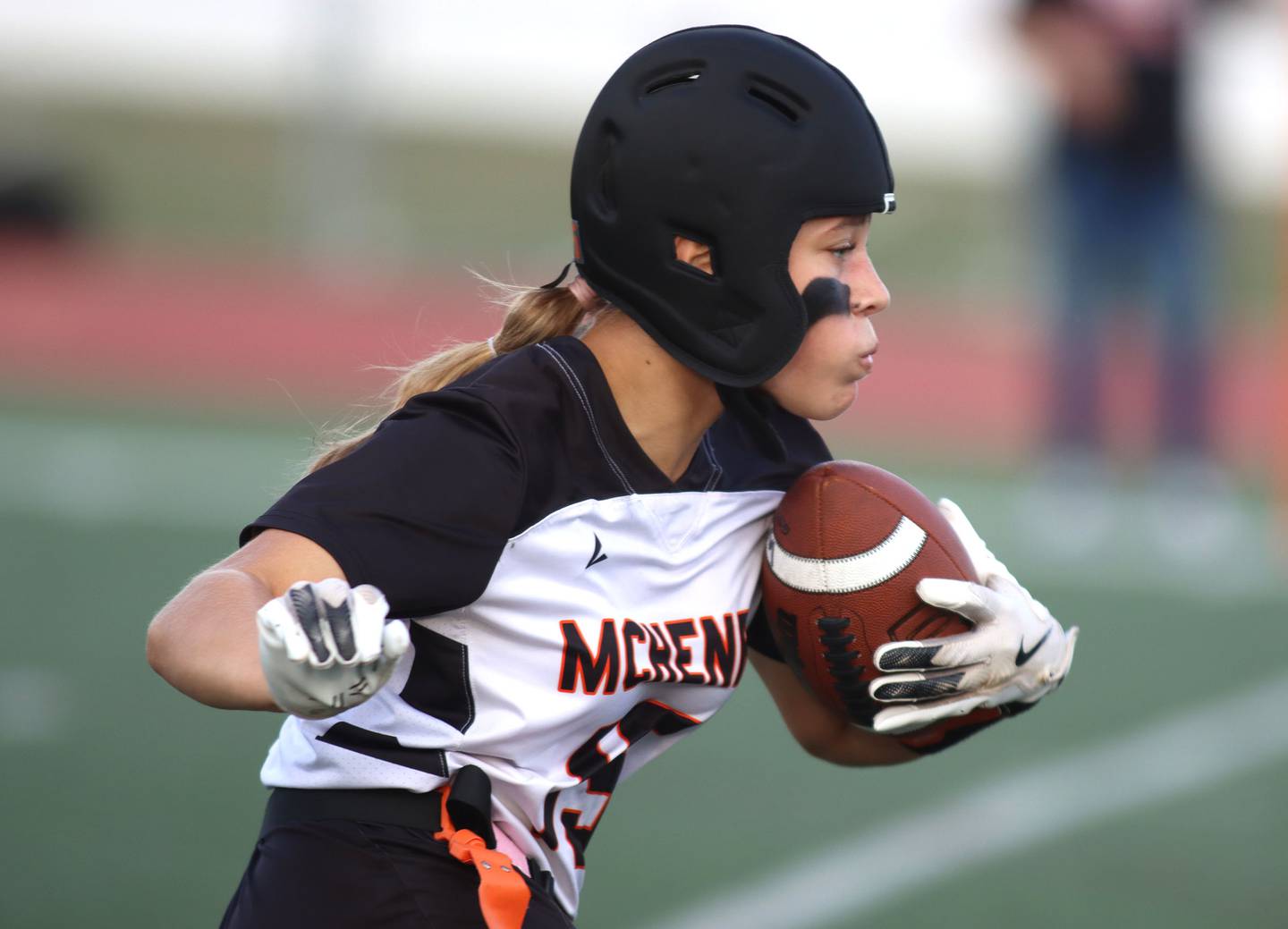 McHenry’s Addison Hoffman carries the ball in varsity flag football at Huntley High School in Huntley on Tuesday, Sept. 9, 2025.