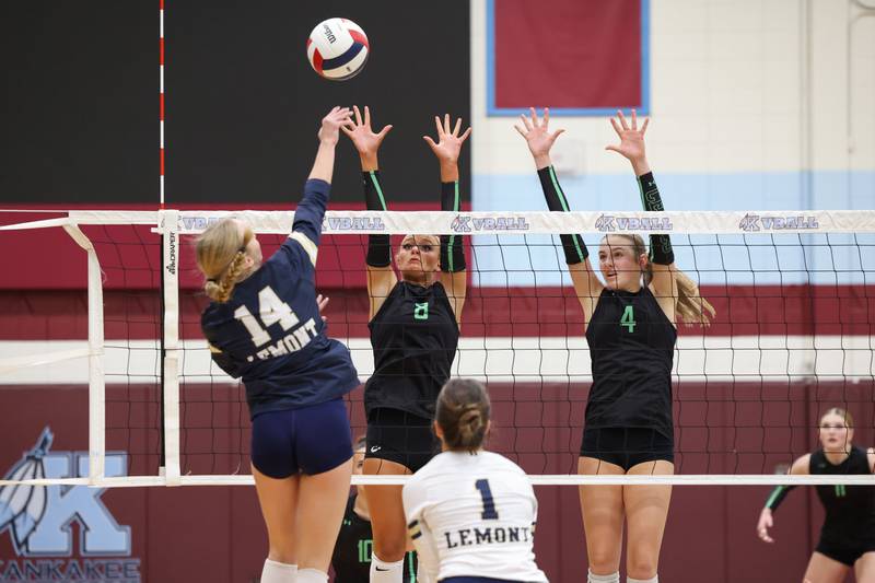 Providence's Demi Carbone (8) and Lilly Lipke jump to block a hit by Lemont's Kaitlyn Wilson during Providence's victory in two sets, 25-25, 25-18, over Lemont in the IHSA Class 3A Kankakee Sectional championship on Thursday, Nov. 6, 2025.