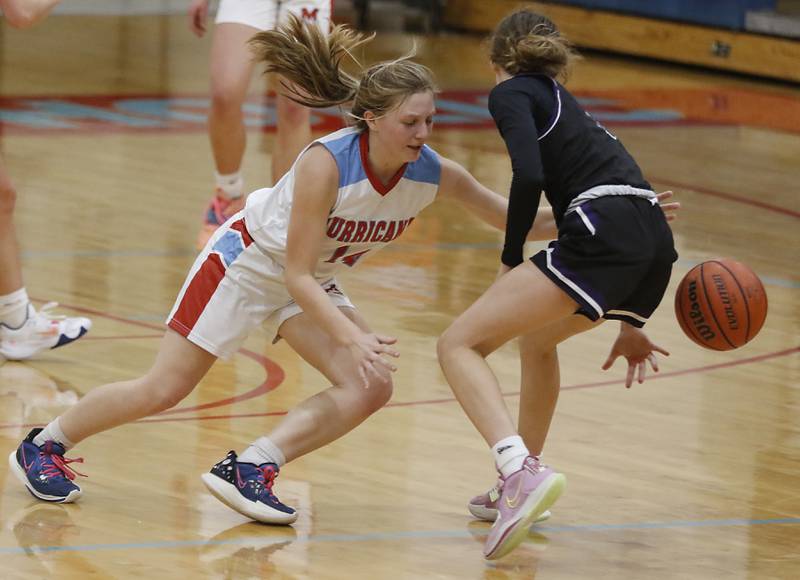 Marian Central's Abbey Miner knocks the ball away from Rockford Lutheran's Soraya Parker during a non-conference girls basketball game Monday, Dec. 12, 2022, between Marian Central and Rockford Lutheran at Marian Central Catholic High School, in Woodstock.
