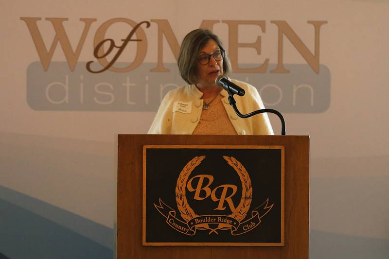 Award recipient Catherine Jones speaks during the Northwest Herald's Women of Distinction award luncheon Wednesday June 4, 2025, at Boulder Ridge Country Club, in Lake in the Hills. The luncheon recognized ten women in the community as Women of Distinction.
