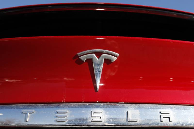 FILE - In this Feb. 2, 2020, file photo, the Tesla company logo is shown in Littleton, Colo. Tesla is recalling nearly all of the vehicles it has sold in the U.S. because some warning lights on the instrument panel are too small.
Documents posted Friday, Feb. 2, 2024 by U.S. safety regulators say the recall will be done with an online software update.  (AP Photo/David Zalubowski, File)