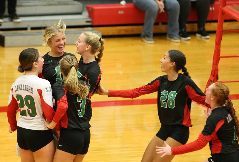 Members of the L-P volleyball team react while playing Ottawa on Tuesday, Oct. 17, 2023 at Sellett Gymnasium.