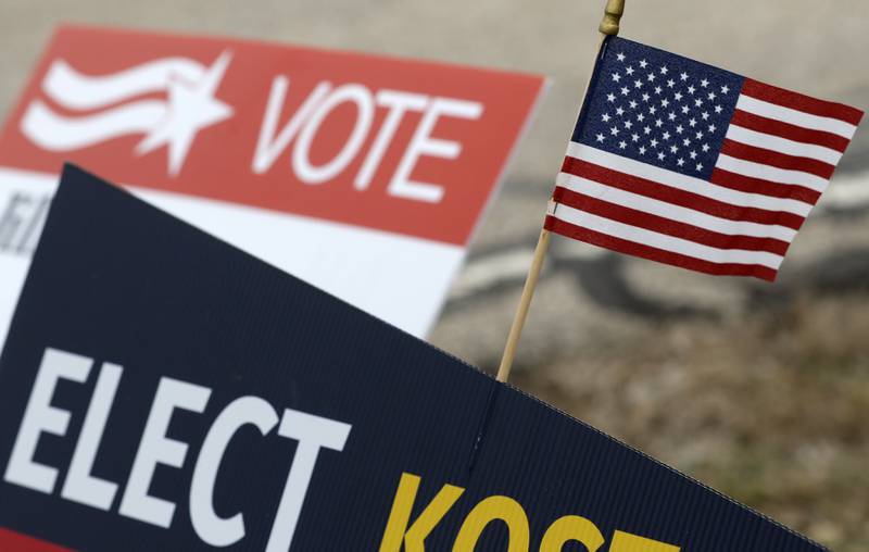 An American flag on a campaign sign on Tuesday, April 1, 2025. in front of the Spring Grove Village Hall.