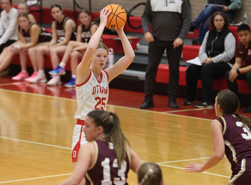 Ottawa's Libby Muffler looks to pass the ball against Morris on Tuesday, Dec. 9, 2025 in Kingman Gymnasium at Ottawa High School.