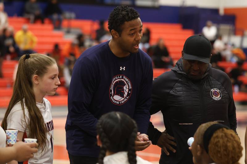 Romeoville head coach Devon Friend talks to the team between quarters against Joliet West on Thursday, Jan. 29, 2026 in Romeoville.