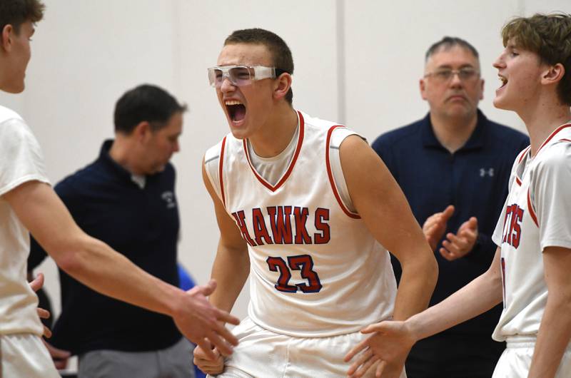 Oregon's Zayden Vandesand (24) comes off the bench to meet his teammates as they react in a win over Rock Falls during a Friday, Jan. 9, 2026 game at the Blackhawk Center in Oregon.