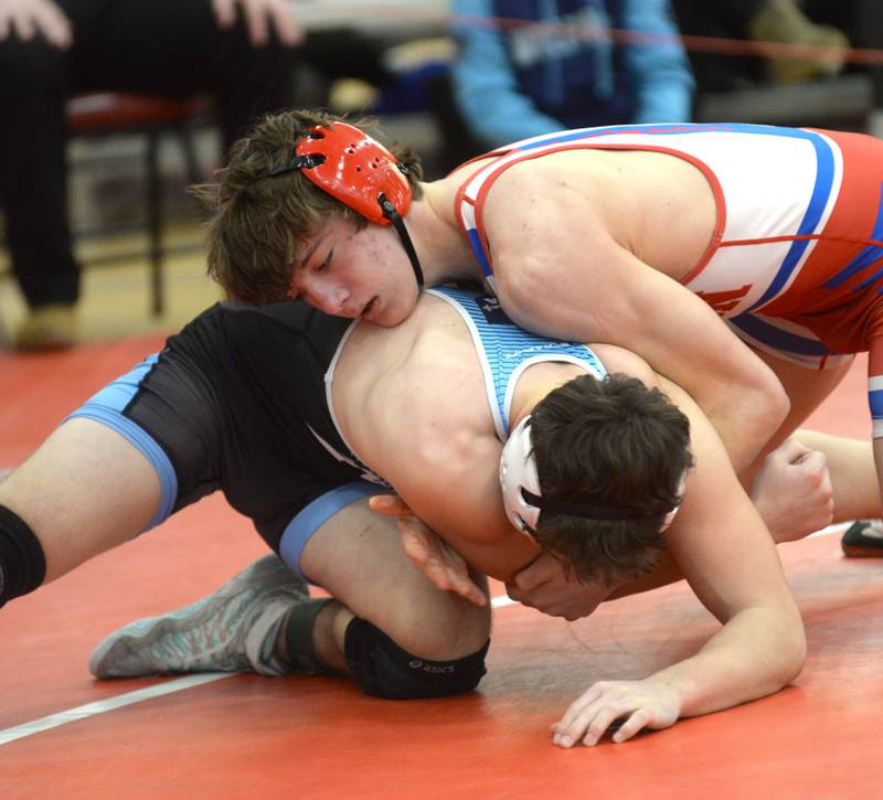 Oregon’s Levi Benton (top) and Ottawa Marquette’s Beau Thompson battle at 138 pounds at the 1A Oregon Sectional on Saturday, Feb. 15, 2025.