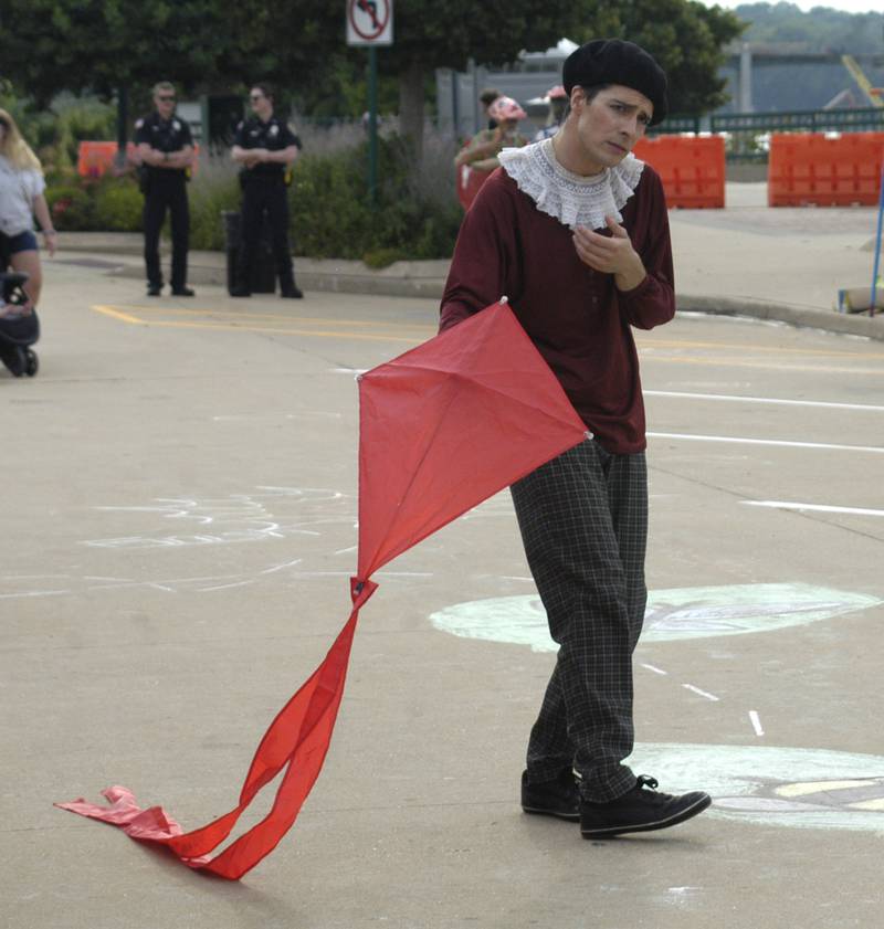 Mime Matthew McMunn takes his kite through the crowd at Venetian Night in Dixon on Aug. 9, 2025.