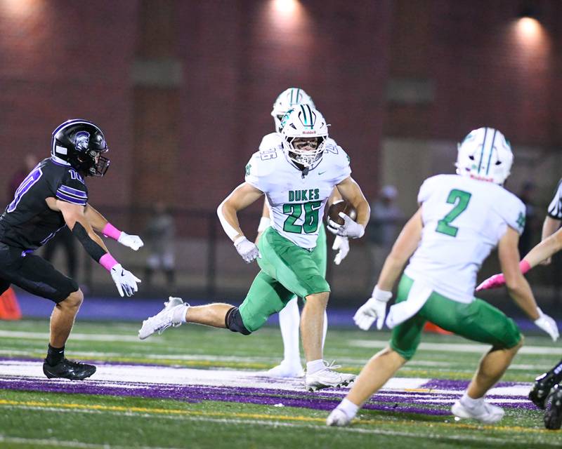 York's Henry Duda (26) runs the ball during the game on Friday Oct. 10 2025, while traveling to take on Downers Grove North High School. while traveling to take on Downers Grove North High School.