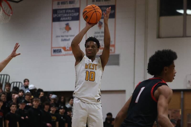 Joliet West’s Zion Gross takes the outside shot against Bolingbrook on Friday, Jan 24, 2025 in Joliet.