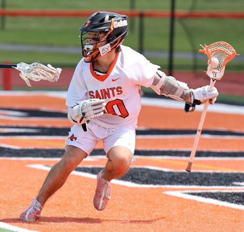 St. Charles East junior Ryan Wilko runs with the ball in a semifinal game against Burlington Central in May 2024.