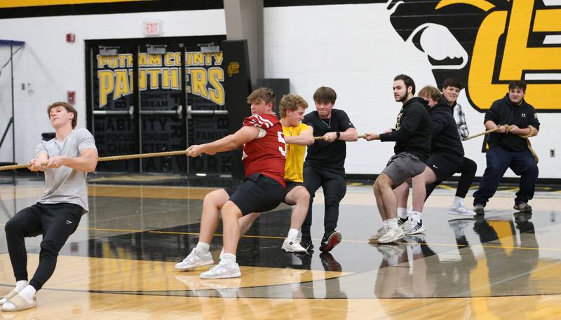 Putnam County High School junior boys play tug-of-war during the football Homecoming Pep Rally on Friday, Sept. 27, 2024 at Putnam County High School in Granville.