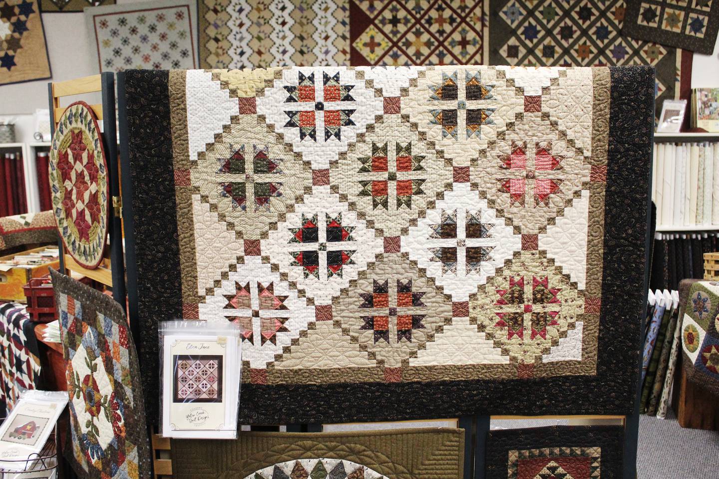 Jill Shaulis' quilts, each branded by a line and pattern name, are sold at Yellow Creek Quilt Designs in Pearl City. Her sixth and current line, Meyer House, consists of quilt patterns themed with triangular and hexagonal shapes in the Civil War reproduction style. Each pattern has a name, and the ones in Meyer House – Seven Meyer Sisters, Scioto Mills, Air Waves, The Blue Room and the titular pattern – are those that are a tribute to her father Ken's family and childhood life.