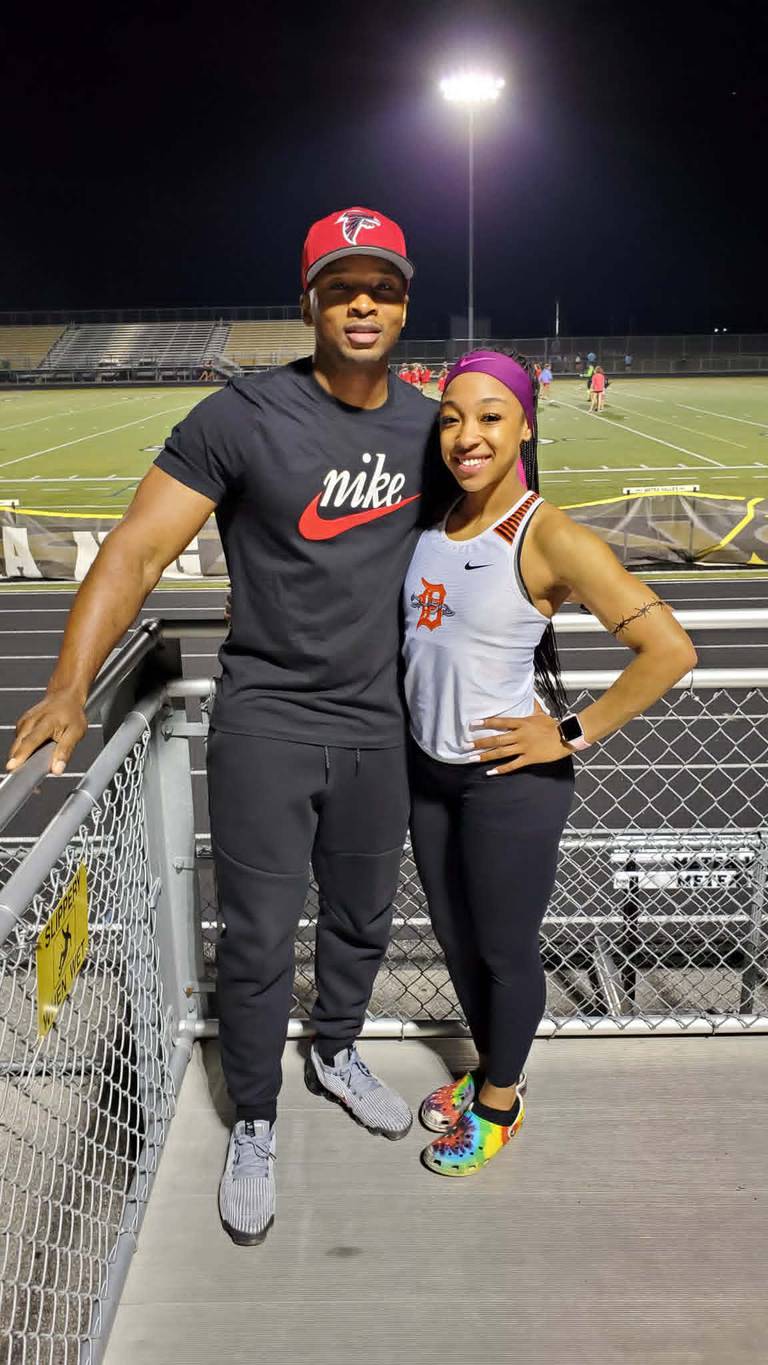 Antonio Watson, of DeKalb, hugs his daughter, Sariyah Watson, in this undated photo. Watson, 21, a junior sprinter for the UIC Flames, was killed on Sunday, May 10, 2026, in a wrong-way crash on Interstate 88 near Aurora.