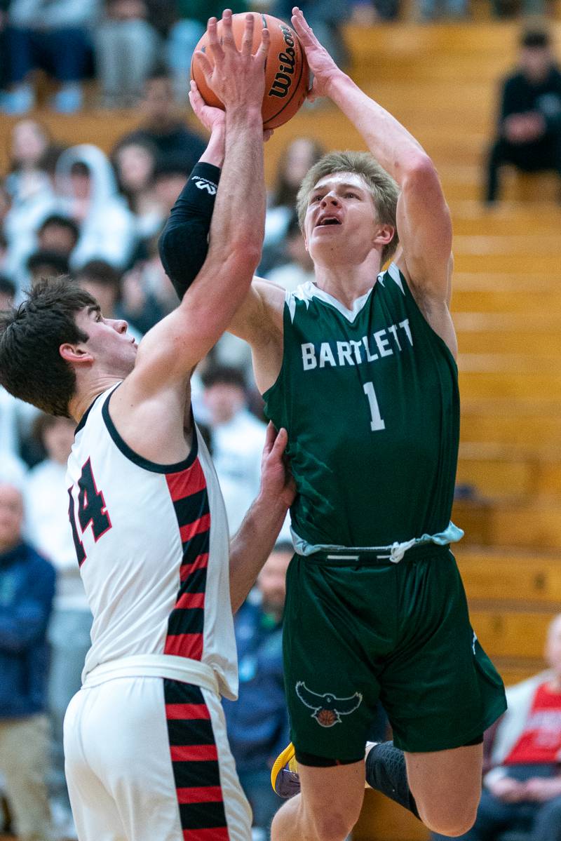 Bartlett's Martin McCarthy (1) shoots the ball along the baseline against Benet’s Parker Sulaver (14) during the 4A Addison Trail Regional final at Addison Trail High School in Addison on Friday, Feb 24, 2023.