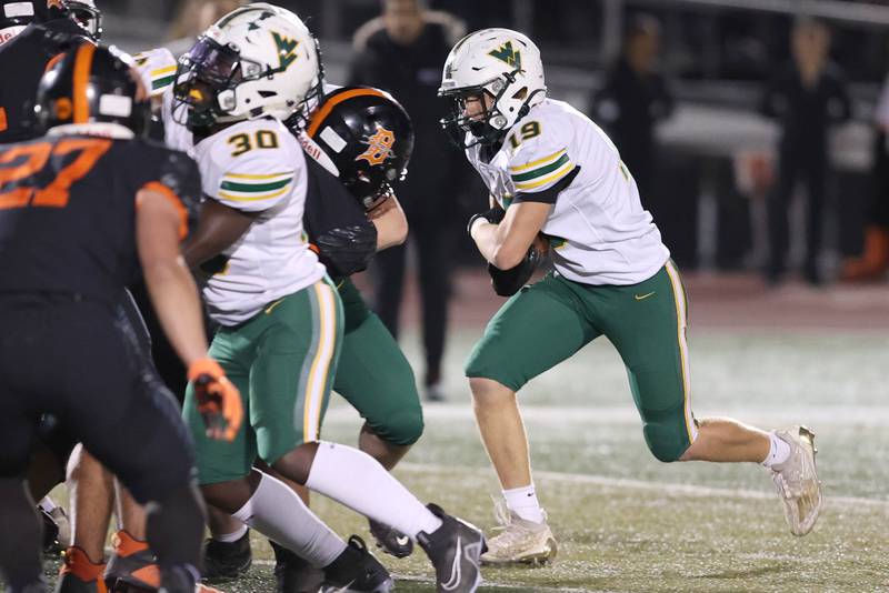 Waubonsie Valley's Mason Ringenbach runs the ball into the DeKalb line during their game Thursday, Oct. 20, 2022, at DeKalb High School.