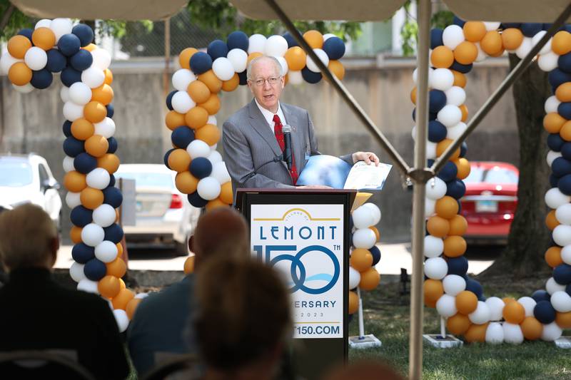 Congressman Bill Foster shares a congressional proclamation at the Lemont 150th Anniversary Commemoration on Friday, June 9, 2023 in downtown Lemont.