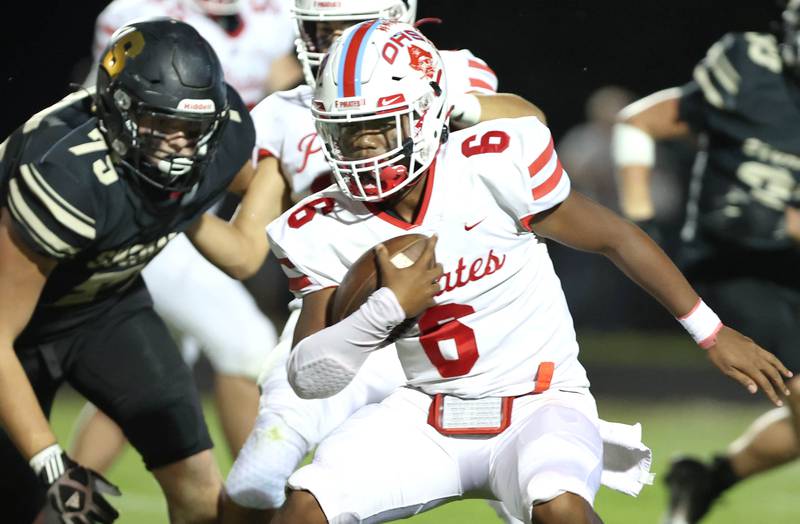 Ottawa's Colby Mortenson is pursued by Sycamore's Brandon Coon and Dylan Hodges during their game Friday, Sept. 16, 2022, at Sycamore High School.