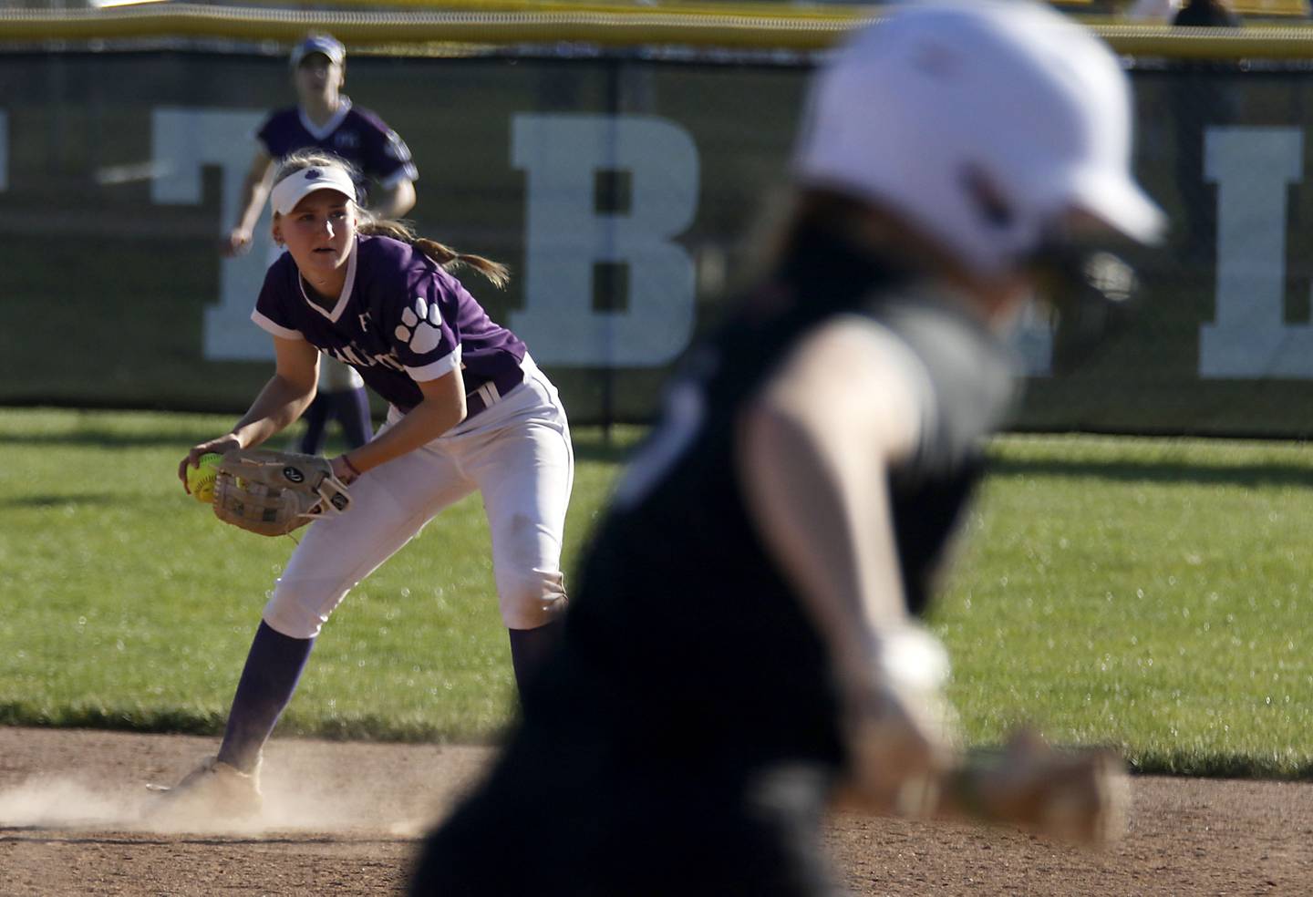 Hampshire's Ali LeBlanc fields the ball before throwing Huntley's Morgan Bzdusek out at first base during a Fox Valley Conference softball game on Thursday, May 14, 2026, at Huntley High School.