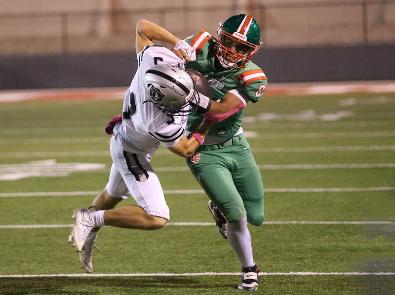 L-P quarterback Marion Persich tries to break free of Kaneland's Griffin Seaton on Friday, Oct. 17, 2025 at Howard Fellows Stadium.