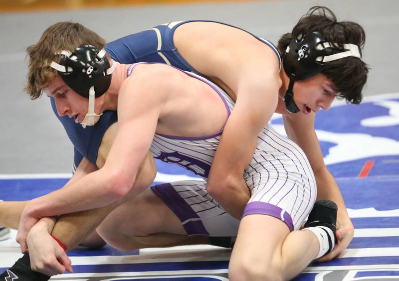 Dixon's Jack Ragan wrestels Marquette's Wesley Janick during the Class 1A Regional meet on Saturday, Jan. 31, 2026 at Princeton High School.