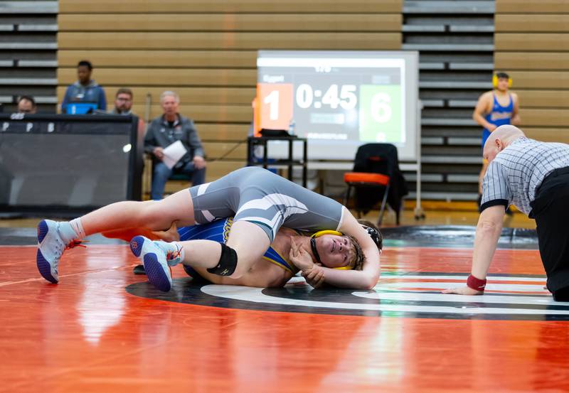 Plainfield East's Robert Vogel goes up against Xavier Eggert of Joliet Central in the 175-pound match at Plainfield East on Dec. 12, 2024.