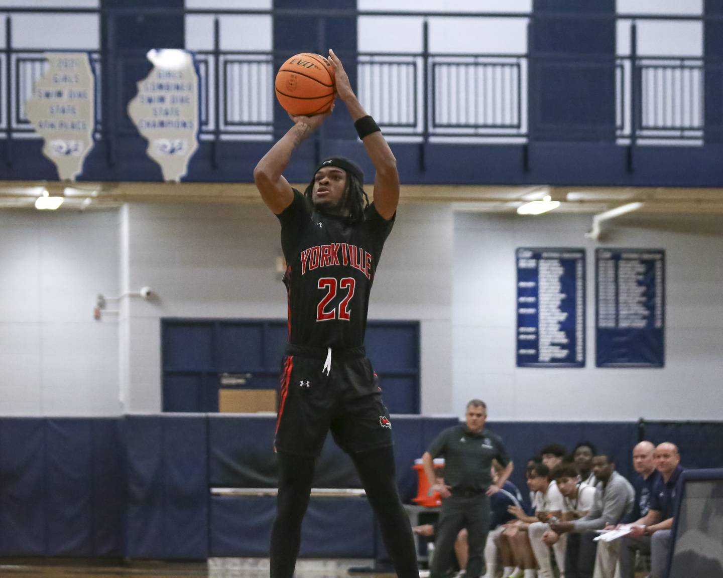 Yorkville's Braydon Porter (22) shoots a three during their basketball game between Yorkville at Oswego East. Friday, Dec 19, 2025 in Oswego.