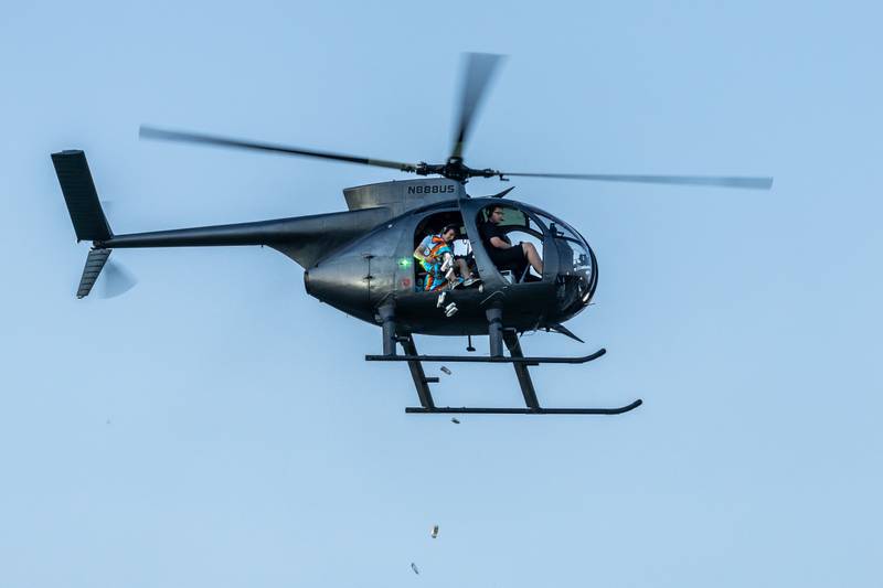 Hot dogs fall from a helicopter during the Wiener Drop World Record Attempt, sponsored by Pabst Light, at Duly Heath and Care Field on July 22, 2025.