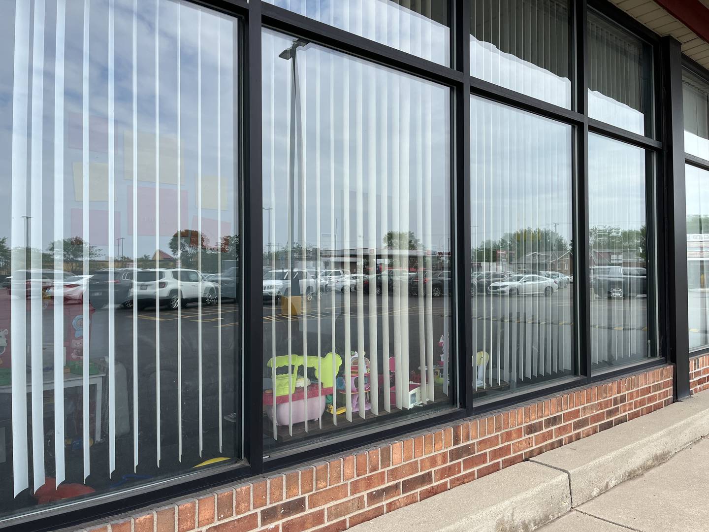 A window to the Joliet office for the Illinois Department of Human Services, 1619 W. Jefferson St., seen on Tuesday, May 24, 2022. A shooting reported on Saturday, May 21, 2022, caused damage to the windows to the building.