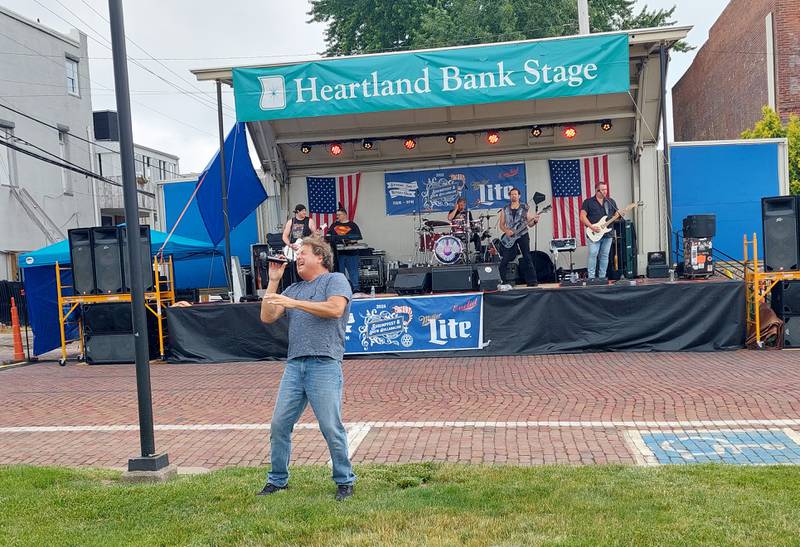 Infinity performs on the main stage Saturday, June 1, 2024, during the ShrimpFest and Brew Hullaballoo at Rotary Park in Princeton.