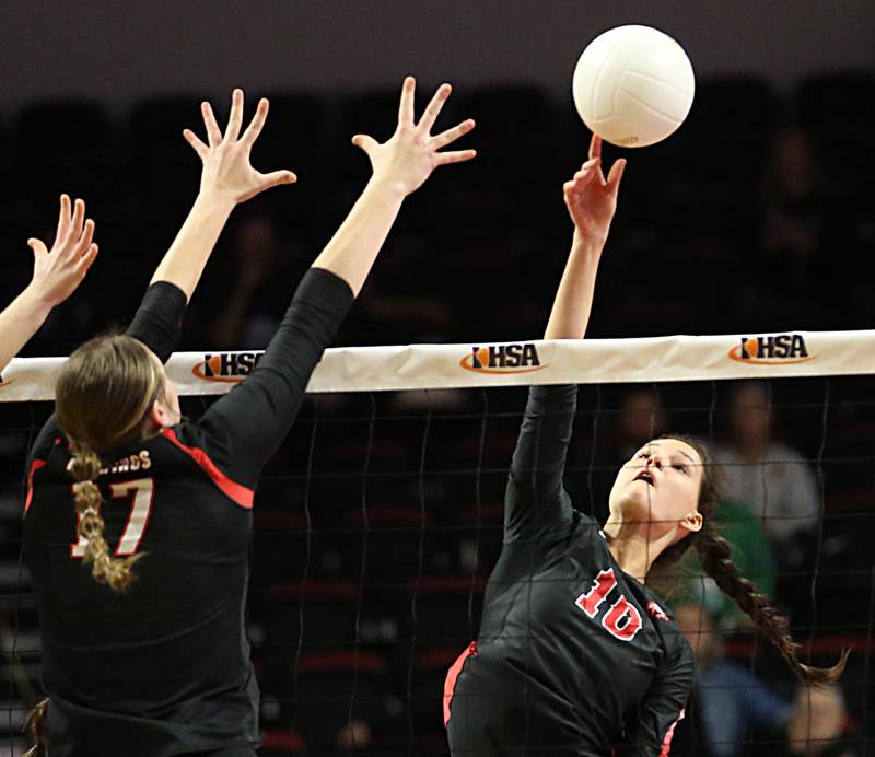 Barrington's Berkeley Ploder (10) tips the ball past Benet's Annie Eschenbach in the Class 4A semifinal game on Friday, Nov. 11, 2022 at Redbird Arena in Normal.