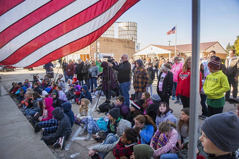 Fourth and fifth graders from the Prophetstown-Lyndon-Tampico school district sit outside of the Reagan birthplace for the Friday celebration.