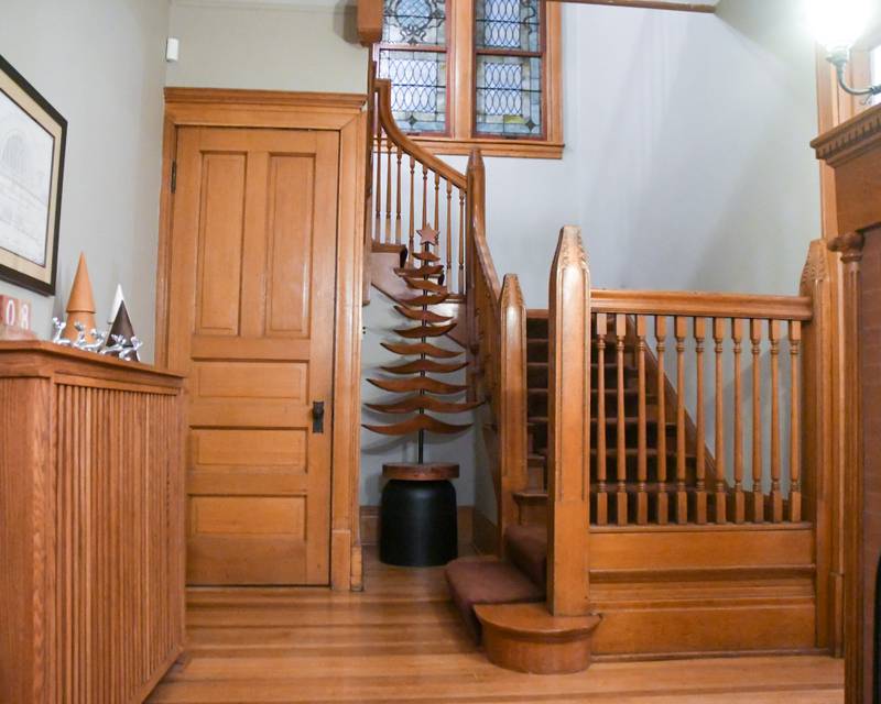 One of two stair cases in the Henderson Home on South La Grange road in La Grange is seen during the Holiday Sip and Sweet Tour event in La Grange on Sunday Dec. 17, 2023.