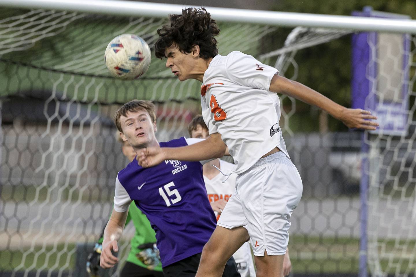 Winnebago’s Drew Intravaia heads the ball in front of Dixon’s Logan Grett Thursday, Sept. 26, 2024, at Dixon High School.