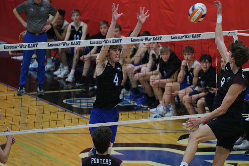 Lincoln-Way East’s Tyler Walenga goes for the block against Lockport in the Lincoln-Way East Tournament 3rd place match. Saturday, April 30, 2022, in Frankfort.